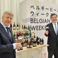 Belgium\'s Ambassador Gunther Sleeuwagen (left), honorary chairman of the Belgian Beer Weekend committee, raises his glass with Konishi Brewing Co. President and Chairman of the committee Shintaro Konishi at a news conference to promote Belgian Beer Weekend 2017 at the Belgian embassy in Tokyo on March 16. Belgium Beer Weekend kicks off in Nagoya on April 26 before moving to seven other cities and ending in Tokyo on Sept. 18. | YOSHIAKI MIURA