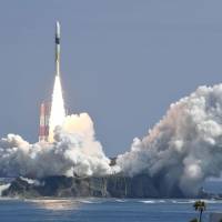 An H-IIA rocket lifts off from its launchpad to carry an information-gathering satellite known as Radar 5 into orbit at Tanegashima Space Center in Tanegashima, Kagoshima Prefecture, on Friday. The launch comes amid surging anxiety in the region over North Korea\'s growing missile and nuclear capabilities. | KYODO