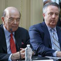 U.S. Commerce Secretary Wilbur Ross (left) sits next to Burlington Northern Santa Fe Railway CEO Matt Roselisten during a meeting with business leaders and President Donald Trump at the White House on Tuesday. | AP