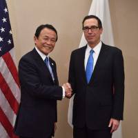 Deputy Prime Minister and Minister of Finance Taro Aso meets with U.S. Treasury Secretary Steven Mnuchin on Thursday in Washington. | AFP-JIJI