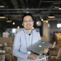 Lin Koji, a Taiwanese engineer for Line Fukuoka Corp., is pictured in the company\'s office in Fukuoka on March 3. | BLOOMBERG