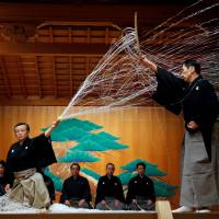 Noh performance master Kiyokazu Kanze performs with other actors at the Kanze Noh Theater ahead of its opening in Ginza Six on April 14. | REUTERS
