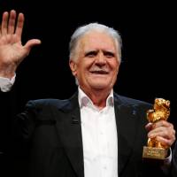 German cinematographer Michael Ballhaus holds an Honorary Golden Bear for his lifetime achievement at the 66th Berlinale International Film Festival in Berlin in 2016. | REUTERS