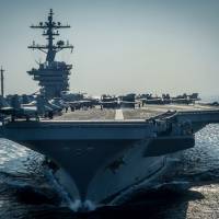 The aircraft carrier USS Carl Vinson prepares for flight operations in the Persian Gulf in December 2014. | AFP-JIJI