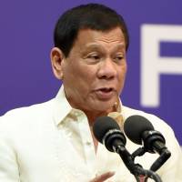 Philippine President Rodrigo Duterte speaks in Riyadh on Wednesday during a meeting with Filipinos living in Saudi Arabia. | AFP-JIJI