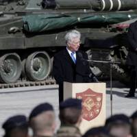 Britain\'s Defense Secretary Michael Fallon speaks during the official ceremony welcoming the deployment of a multi-national NATO battalion in Tapa, Estonia, Thursday. | REUTERS