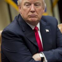 U.S. President Donald Trump speaks during a meeting with manufacturers in the Roosevelt Room of the White House on Friday. Trump is learning the hard way his power is limited by Congress and courts