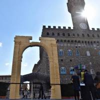 A reproduction of the Arch of Triumph from Palmyra, Syria, is displayed on March 27 in the Piazza della Signoria in Florence, Italy. The Islamic State group in 2015 destroyed the arch. Now a symbol of the vulnerability of World Heritage sites, the reproduction was displayed for the Group of Seven gathering in Florence. | AP