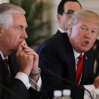 U.S. President Donald Trump speaks next to Secretary of State Rex Tillerson during a bilateral meeting with China\'s President Xi Jinping (not pictured) at Trump\'s Mar-a-Lago estate in Palm Beach, Florida, Friday. | REUTERS