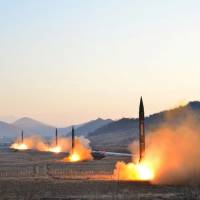 Four North Korean ballistic missiles are launched simultaneously in a drill in this photo released by the official Korean Central News Agency on March 7. | KCNA / VIA REUTERS