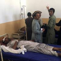 A Pakistani bombing victim is treated at a hospital in the tribal district of Kurram on Tuesday. At least nine people were killed, including women and children, and 13 others injured when a passenger vehicle struck a roadside bomb in Pakistan\'s northwest tribal region bordering Afghanistan. | AFP-JIJI