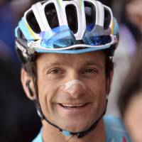 Italy\'s Michele Scarponi smiles at the start of the 14th stage of the Giro d\'Italia, Tour of Italy cycling race on May 24, 2014. | AP