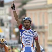 Italy\'s Michele Scarponi reacts as he crosses the finish line of the 18th stage of the Giro d\'Italia cycling race from Sulmona to Benevento, Italy, on May 28, 2009. | AP