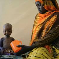 A malnourished girl is fed by her mother at a hospital in Baidoa, the capital of Somalia’s Bay region, on March 15. U.N. fears deaths from mass starvation in Horn of Africa, Yemen and Nigeria