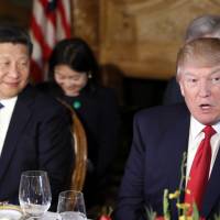 U.S. President Donald Trump and Chinese President Xi Jinping attend a dinner at Mar-a-Lago  on Thursday in Palm Beach, Florida. | AP