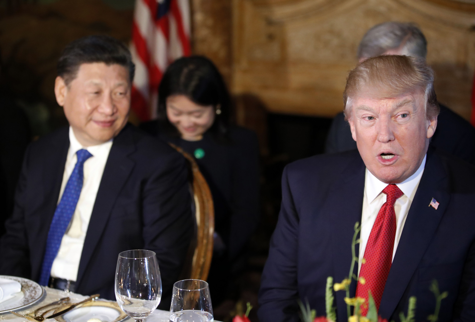 U.S. President Donald Trump and Chinese President Xi Jinping attend a dinner at Mar-a-Lago  on Thursday in Palm Beach, Florida. | AP