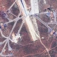 Destroyed aircraft shelters at the Shayrat air base in Syria are seen in this satellite image following U.S. Tomahawk missile strikes earlier on Friday. | AP