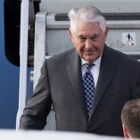 U.S. Secretary of State Rex Tillerson steps out of a plane upon arrival in Moscow\'s Vnukovo airport Tuesday. Tillerson is due to meet with Russian Foreign Minister Sergey Lavrov on Wednesday. | AP