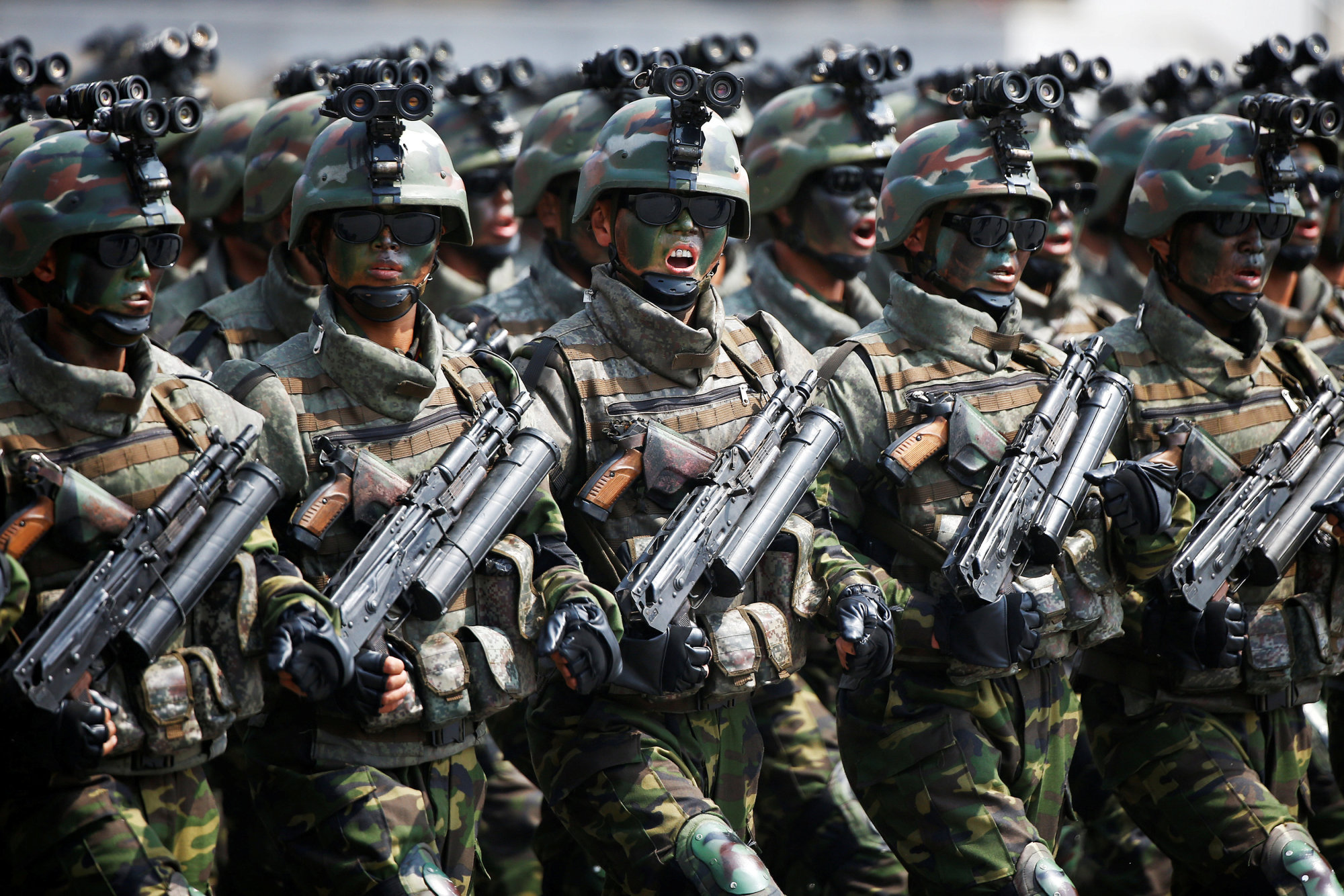 North Korean special forces soldiers march and shout slogans during a military parade marking the 105th anniversary of the birth of the country's founder, Kim Il Sung, in Pyongyang on April 15. | REUTERS