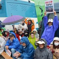 People gather in Nago, Okinawa Prefecture, on April 1 for a protest against the planned transfer of a U.S. military base, marking the 1,000th day of a sit-in near the relocation site. Planned new V-shaped runways in Okinawa 'too short for certain aircraft': U.S.