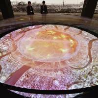 Computer generated imagery at the Hiroshima Peace Memorial Museum shows how the atomic bomb exploded over the city and destroyed it on Aug. 6, 1945. | KYODO