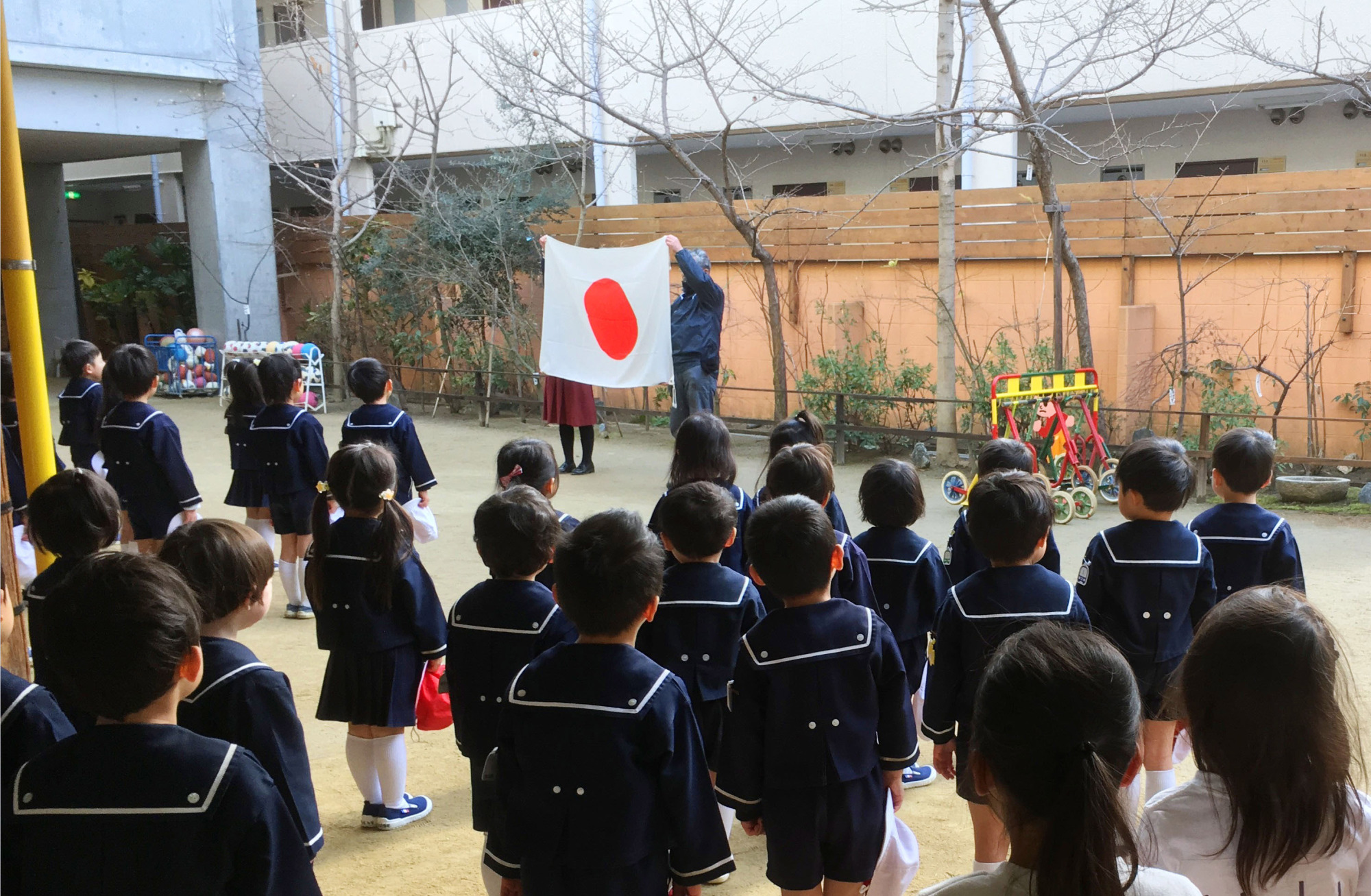 Pupils at Tsukamoto Kindergarten in Osaka, run by scandal-tainted Moritomo Gakuen, recite the Imperial Rescript on Education during a morning assembly in February. | KYODO