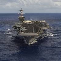 The USS Carl Vinson aircraft carrier transits the Pacific Ocean in January. | REUTERS
