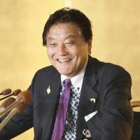 Nagoya Mayor Takashi Kawamura smiles at a news conference on Sunday night. KYODO | KYODO