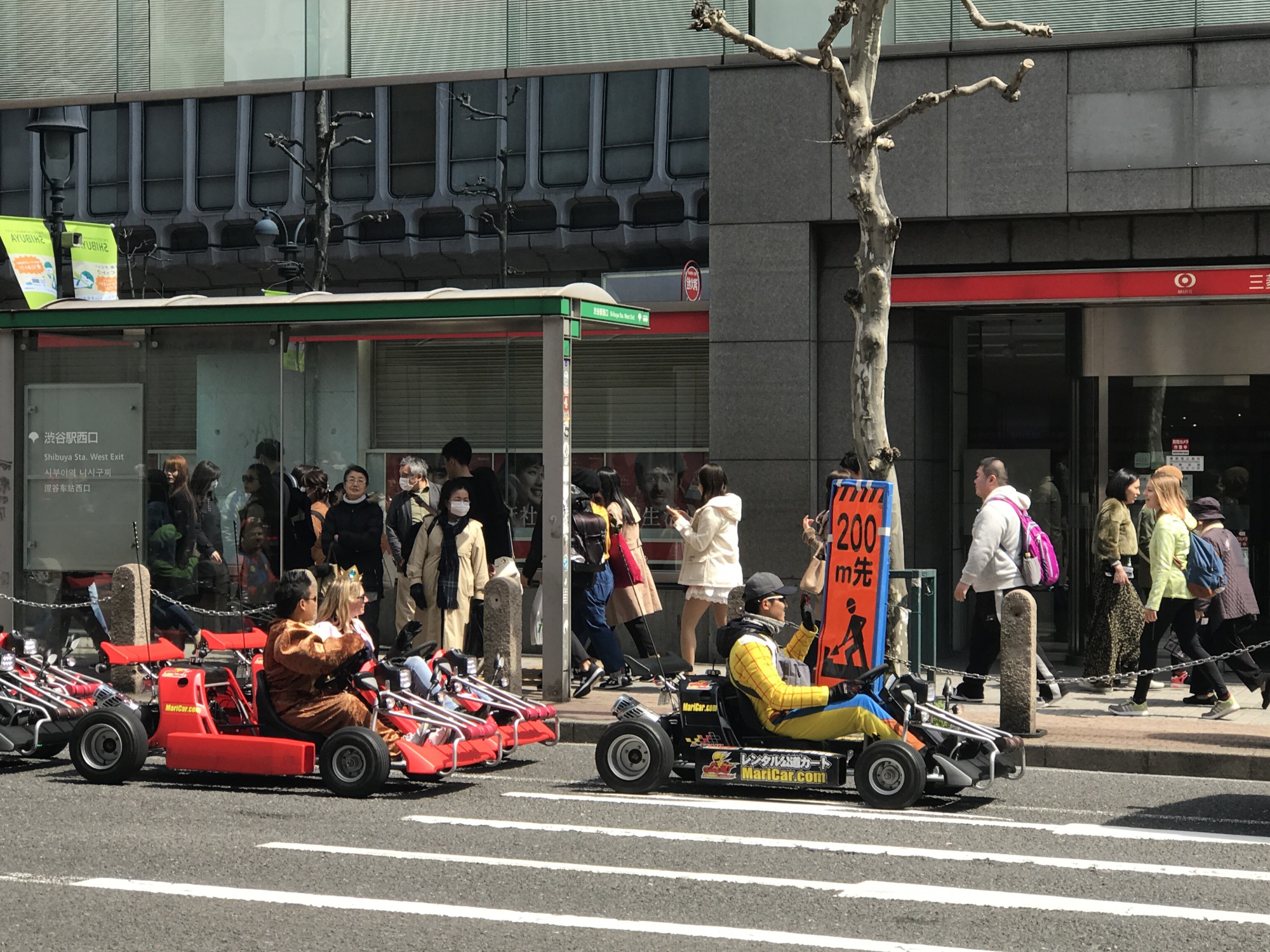 People dressed in Nintendo video game characters drive go-karts in Tokyo on April 2. | MAGDALENA OSUMI