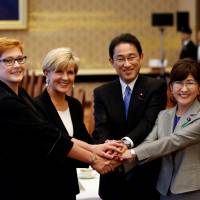 Left to right: Australian Defense Minister Marise Payne, Australian Foreign Minister Julie Bishop, Foreign Minister Fumio Kishida and Defense Minister Tomomi Inada pose before the start of their “two plus two” meeting on Thursday in Tokyo. Japan and Australia move to bolster defense ties in Asia