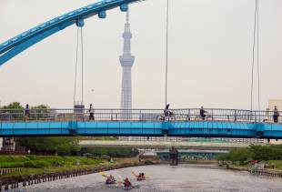 Kayakers on the Kyunaka River pass under a bridge in Tokyo’s Koto Ward.