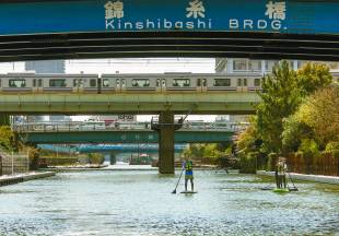 Paddle boarders take to the waters of Yokojuken River in Tokyo.