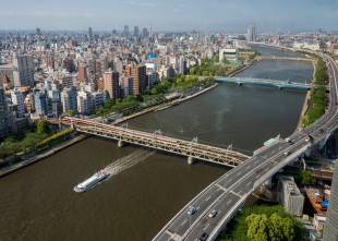 A river cruiser travels down the Sumida River in Tokyo. Rob Gilhooly