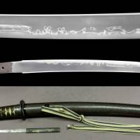 A sword made by Minryushi Toshizane in 1821 is on display with a saya scabbard and tsuba guard at the Japan Sword Gallery in Toranomon, in Tokyo\'s Minato Ward in April. | JAPAN SWORD