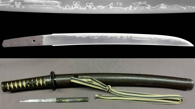 A sword made by Minryushi Toshizane in 1821 is on display with a saya scabbard and tsuba guard at the Japan Sword Gallery in Toranomon, in Tokyo’s Minato Ward in April. Antique sword showcases traditional technique