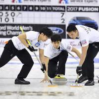 The Japan men\'s curling team competes against Canada on Wednesday at the world championships in Edmonton, Alberta. | KYODO