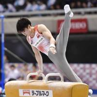 Kohei Uchimura competes on the pommel horse during the national championships on Friday at Tokyo Metropolitan Gymnasium. | KYODO