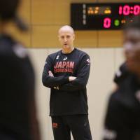Japan women\'s basketball coach Tom Hovasse watches his team practice at the National Training Center in Tokyo earlier this week. | KAZ NAGATSUKA