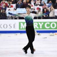 Olympic champion Yuzuru Hanyu gave a spectacular performance in his free skate, coming from fifth place after the short program, to capture his second world title on Saturday night in Helsinki. | KYODO