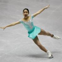 Mai Mihara performs during the women\'s free skate at the World Team Trophy on Saturday night at Yoyogi National Gymnasium. Mihara received 146.17 points, breaking Satoko Miyahara\'s national record. | REUTERS