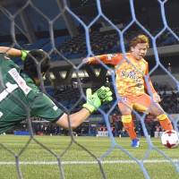 Shimizu S-Pulse\'s Shota Kaneko scores a first-half goal against Kawasaki Frontale on Friday night. It was the 20,000th goal in J. League first-division history. | KYODO