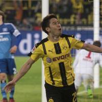 Shinji Kagawa celebrates after scoring for Borussia Dortmund against Hamburg on Tuesday. | AP