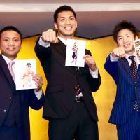 Boxers Ryota Murata (center) Daigo Higa (left) and Kenshiro Teraji pose for photos during a news conference on Monday. All three will be fighting for world titles on May 20. | KAZ NAGATSUKA