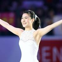 Kanako Murakami acknowledges the crowd after performing in Sunday\'s exhibition for the World Team Trophy at Yoyogi National Gymnasium. | KYODO