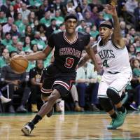 Chicago’s Rajon Rondo (left) drives past Boston’s Isaiah Thomas during the Bulls’ 111-97 win in Game 2 of their playoff series on Tuesday. Bulls take 2-0 lead on top-seeded Celtics