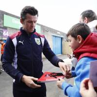 Burnley’s Joey Barton, seen signing autographs for fans earlier this month, is appealing his 18-month ban for gambling. Barton banned while gambling sponsors permeate game