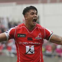 The Sunwolves\' Rahboni Warren-Vosayaco celebrates after the team\'s victory over the Bulls at Prince Chichibu Memorial Ground on Saturday. | AP