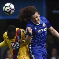 Chelsea\'s David Luiz (right) and Crystal Palace\'s Christian Benteke compete for the ball on Saturday. | REUTERS
