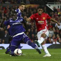 Manchester United’s Marcus Rashford scores the winning goal in extra time during his team’s Europa League quarterfinal victory over Anderlecht at Old Trafford on Thursday. United reaches Europa League semis but loses Ibrahimovic