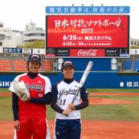 Japan softball national team pitcher Yukiko Ueno (left) and outfielder Eri Yamada pose for a photo at Yokohama Stadium on Monday. | KAZ NAGATSUKA